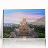 Acrylic print of a serene Georgian landscape in pastel shades, framed in white, suitable for nursery wall art.