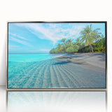 Mid-century modernist art depicting a serene Maldivian seascape in cool blue tones, framed in silver acrylic.