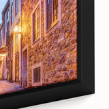 Close-up of a framed canvas featuring a textured, colorful depiction of Quebec scenery, ideal for living room decor.