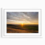 Abstract art print of a Saskatchewan landscape in muted earth tones, framed with a white mat.