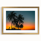 Abstract art print of a Caribbean scenery in muted blue and green tones, framed in gold, ideal for dining room decor.