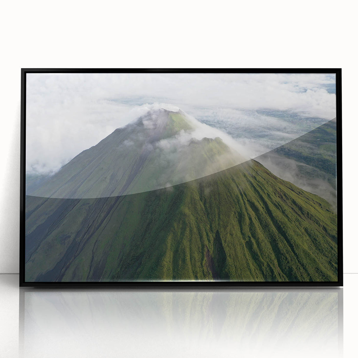 Large abstract wall art depicting a stylized Costa Rican landscape in muted earth tones, framed in black acrylic.