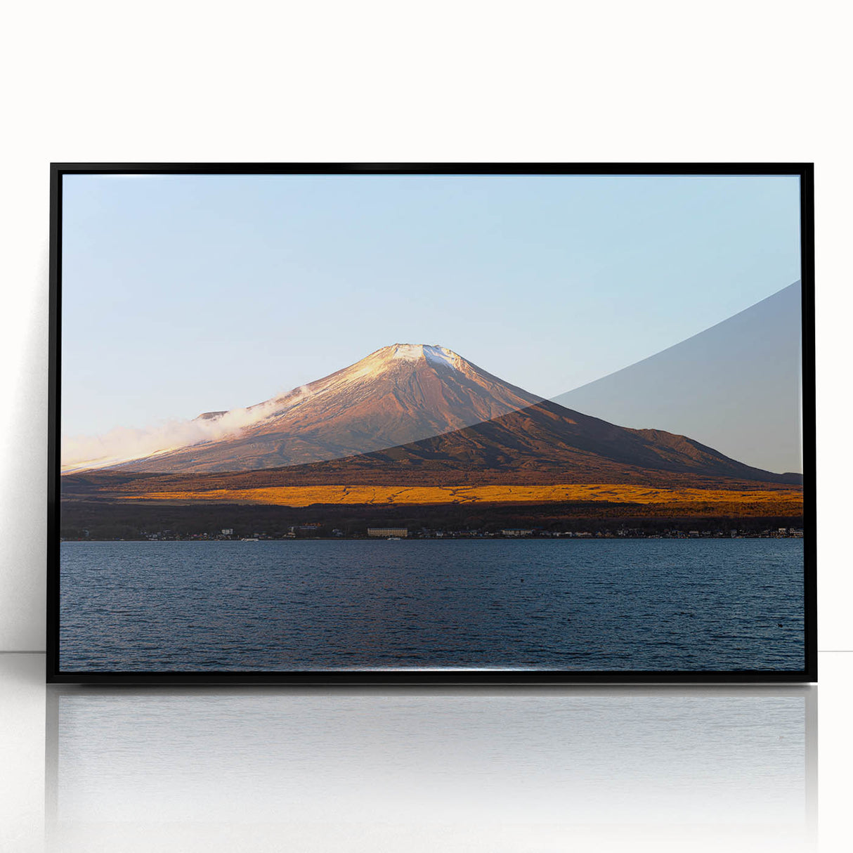 Large abstract wall art of a Central American landscape in muted earth tones, framed in black acrylic.