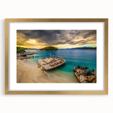 Abstract art print of a European Albanian landscape in muted gold and blue tones, framed with a gold mat.