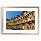 Extra large abstract art print of a European cityscape in muted gray, framed in silver, ideal for living room decor.