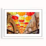 Textured abstract art print of Piccadilly, England in muted tones on a white-framed mat, ideal for bedroom ambiance.