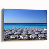 Framed canvas featuring a vintage-style landscape painting of Nice, France in muted gold and black tones.