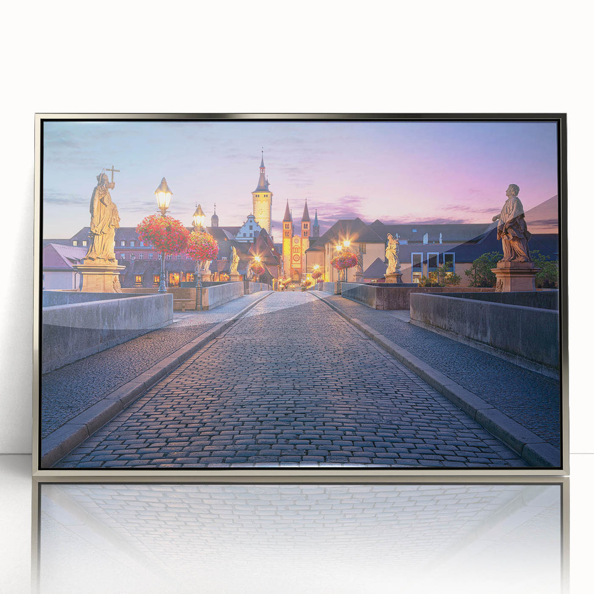 Large art print of a Bavarian landscape in muted green and blue tones on a silver-framed acrylic.