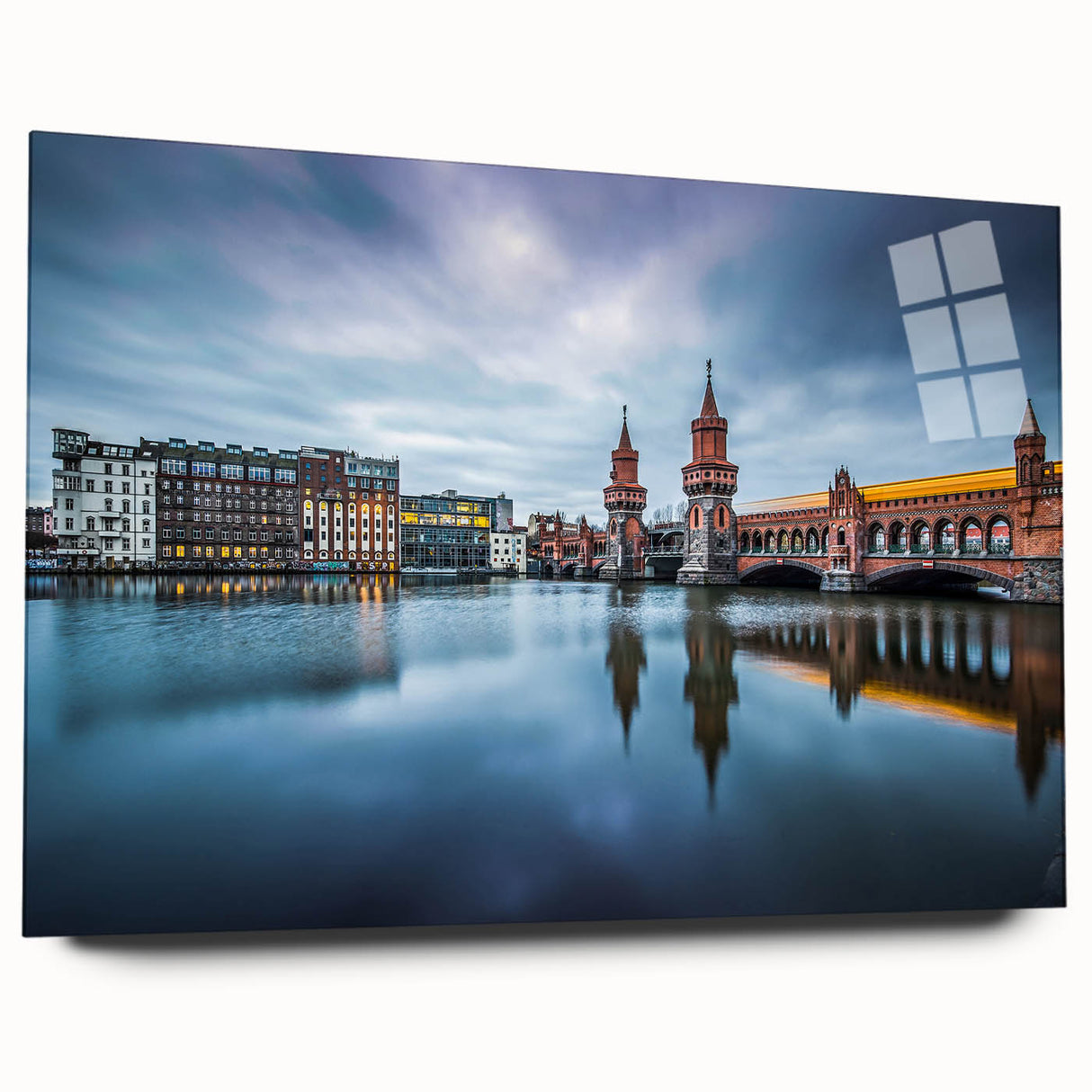 Large abstract art print of Berlin skyline in cool blue and gray tones on acrylic glass.