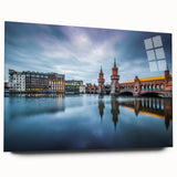 Large abstract art print of Berlin skyline in cool blue and gray tones on acrylic glass.