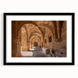 Colorful abstract art print of a European scenery, textured finish on a large black-framed canvas.