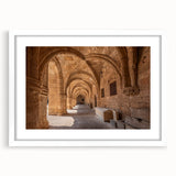 Textured abstract art print of Rhodes, Greece, in muted earth tones on a framed white mat, ideal for bedroom art.
