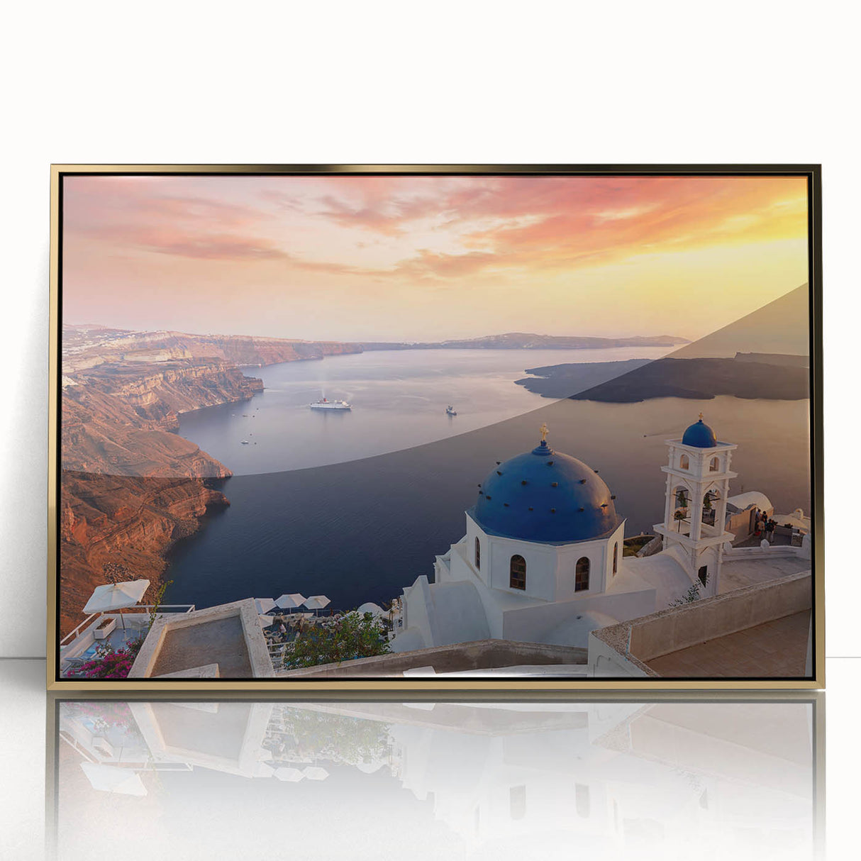 Acrylic print of Santorini scenery with white buildings and blue domes, framed in gold, ideal for modern art wall decor.