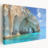 Panoramic view of a Greek coastline on a large stretched canvas, featuring vivid blue and white tones.