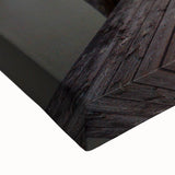 Large art depicting a black and white landscape painting of a European scenery on stretched canvas.