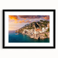 Colorful abstract art print of the Amalfi Coast in a black frame with mat, ideal for living room decor.