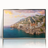 Large art print of Amalfi Coast with vivid blue and white tones, framed in silver acrylic.