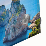 Large abstract wall art of Capri, Italy in muted blue and green tones on acrylic glass, suitable for dining room decor.