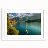 Textured art print of Lake Como with muted blue and green tones on a framed white mat, suitable for bedroom wall decor.