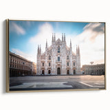 Framed canvas featuring a vintage-style landscape painting of Milan, Italy, in muted gold and black tones.