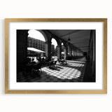 Abstract art print of Rome with muted gold and ivory tones on a framed canvas, suitable for dining room decor.