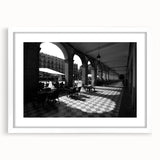 Textured abstract art print of Rome scenery in muted earth tones on a framed white mat, suitable for bedroom decor.