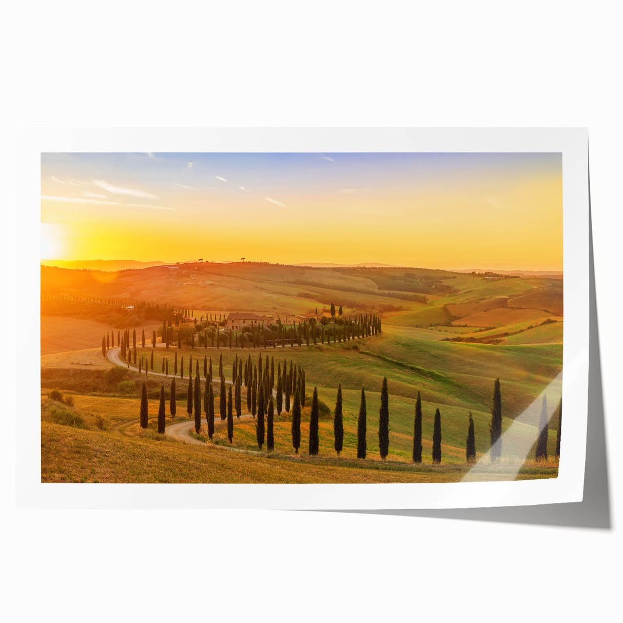 Rolled print of a Tuscan landscape with vibrant green fields and a clear blue sky, ideal for dining room wall art.