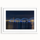 Textured abstract art print of a European landscape in muted earth tones on a framed white mat, ideal for bedroom decor.