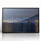 Large abstract wall art depicting a European cityscape in muted gray and blue tones on a framed acrylic.