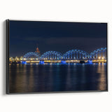 Black and white wall art featuring a vintage poster-style landscape of Latvia on a framed canvas, ideal for bedroom decor.