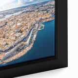 Extra large framed canvas featuring a textured depiction of a European Malta scenery in black with colorful art accents.