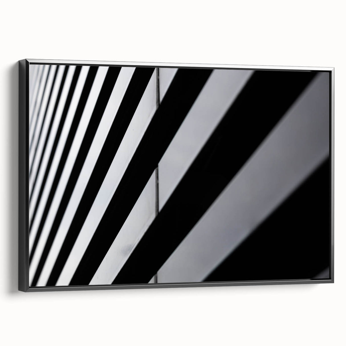 Black and white framed canvas of Amsterdam landscape with vintage poster art style, suitable for bedroom decor.
