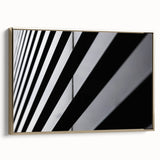 Framed canvas of Amsterdam landscape with vintage poster style in black and gold tones, ideal for bedroom wall art.