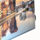 Large abstract wall art of a European cityscape in muted gray and blue tones on acrylic glass.