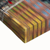 Large art featuring a black and white landscape painting of European scenery on stretched canvas.