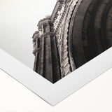 Art deco poster of Barcelona skyline in muted blue and cream hues on rolled canvas, suitable for dining room decor.