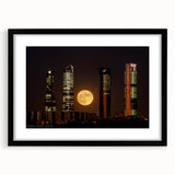 Extra large abstract art print of Madrid scenery in vibrant colors on a black framed canvas, ideal for living room decor.