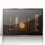 Mid-century modernist art of Madrid skyline in muted earth tones on a silver-framed acrylic print.