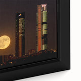 Black wall art featuring a textured, colorful Madrid cityscape on a large framed canvas, ideal for living room decor.