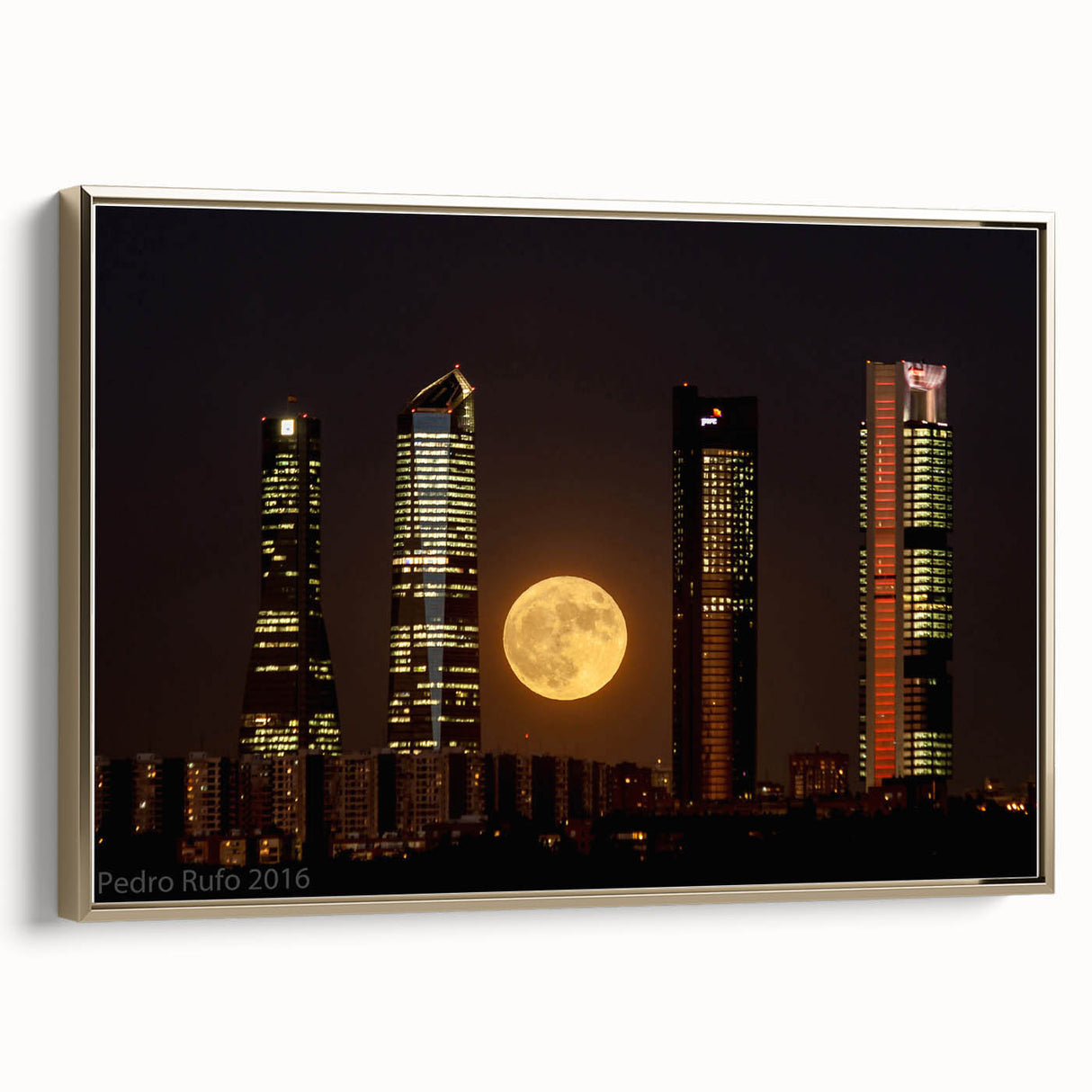 Framed canvas of a vintage-style Madrid landscape in black and gold tones, suitable for bedroom wall art.