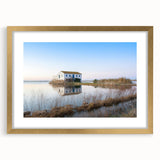 Extra large abstract art print of a textured European scenery in Valencia with muted earth tones on a gold-framed canvas.