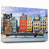 Large abstract wall art depicting a European scenery in muted blues and greens on acrylic glass.