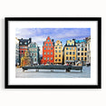 Extra large abstract art print of a vibrant, colorful European scenery on a textured canvas, framed in black.