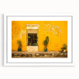 Abstract art print of Mexico City scenery in muted earth tones on a framed white mat, ideal for dining room decor.
