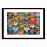 Colorful abstract art print of a textured Mexican landscape in vibrant hues, framed in black, ideal for living room decor.