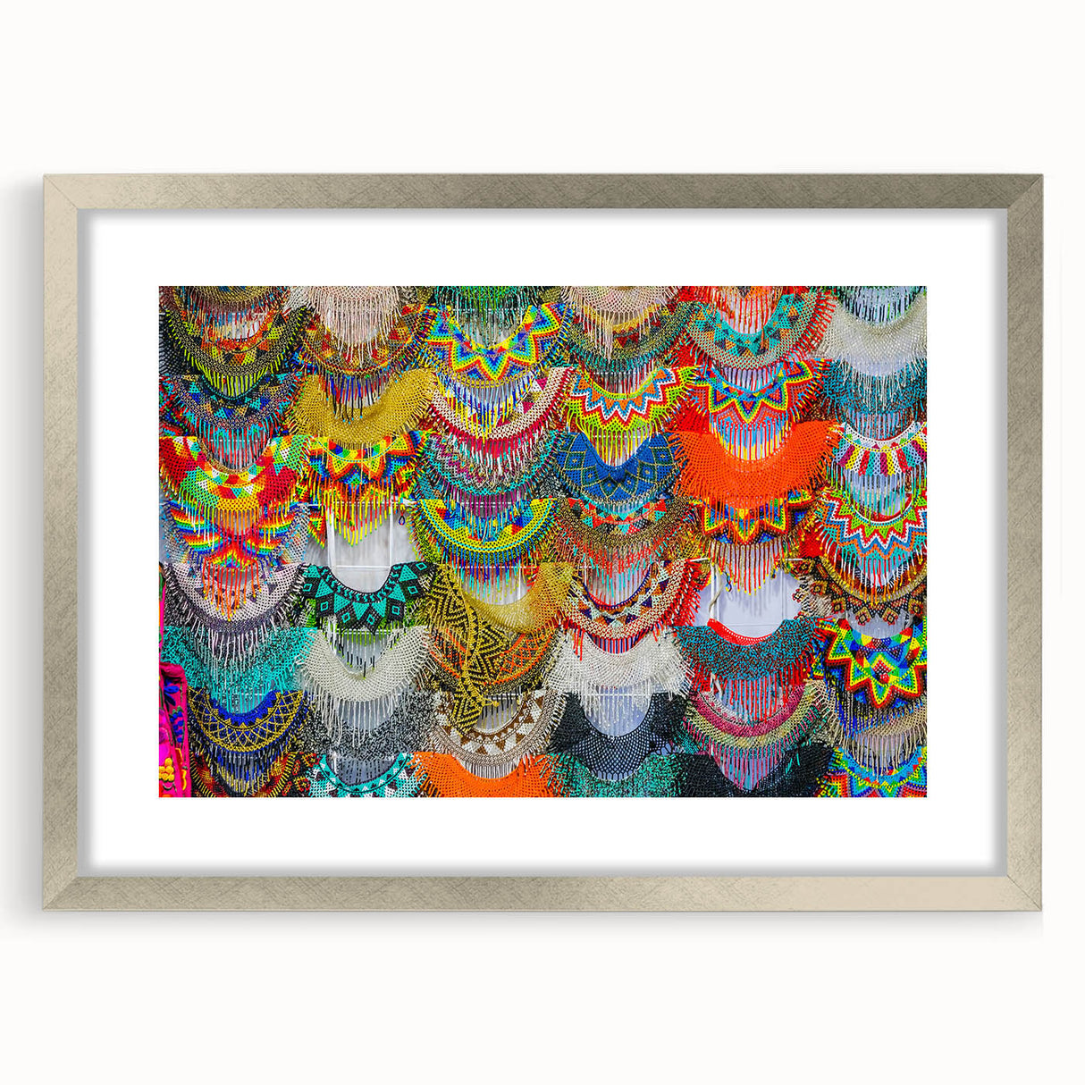 Textured abstract art print of Oaxaca scenery in muted earth tones, framed in silver, ideal for bedroom wall decor.
