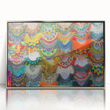 Mid-century modernist art depicting Oaxaca scenery in vibrant colors on a silver-framed acrylic.