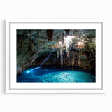 Abstract art print of Yucatán scenery in muted green and blue tones on a framed canvas.