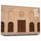 Large abstract depiction of Dubai skyline in muted gold and blue tones on acrylic glass.