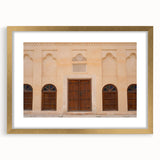 Extra large abstract art print of Dubai skyline in textured gold tones on a framed canvas, ideal for living room decor.